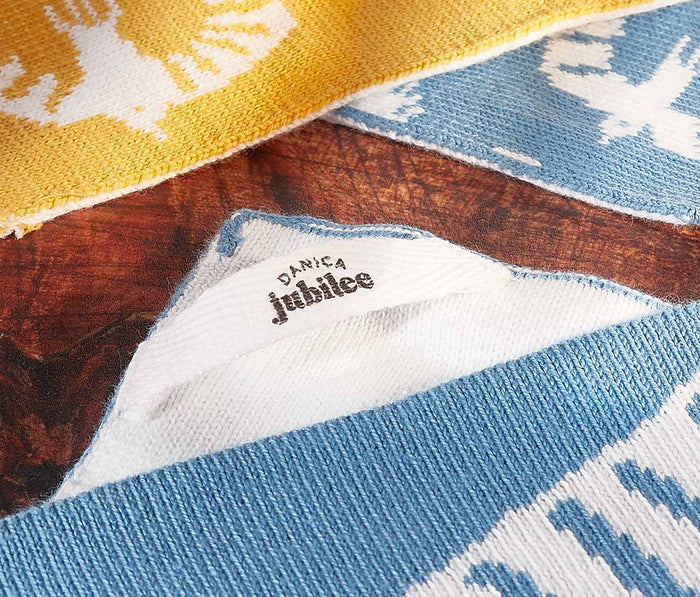 Close-up of a fabric with a danica  label on a textured background