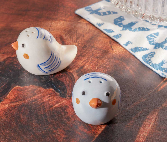 Ceramic bird salt and pepper shaker set on dining table - Lollygag