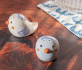 Ceramic bird salt and pepper shaker set on dining table - Lollygag