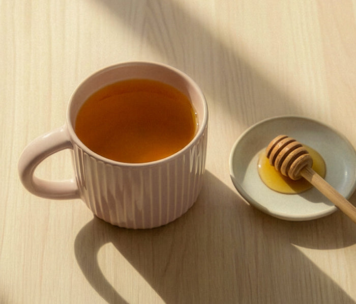 Neutral earth-tone coffee mug set styled with cozy home décor