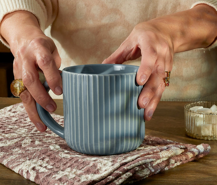Hand holding a modern 
Blue Extra Large Mugs Set - lollygag