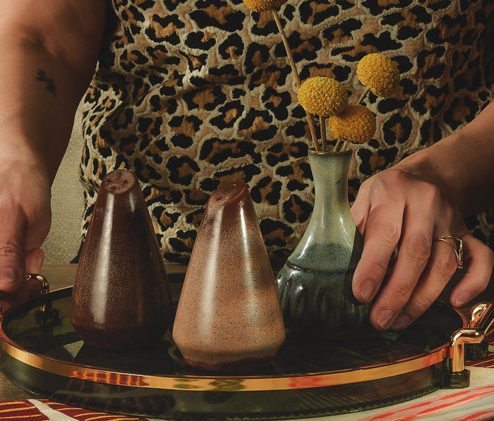 Beautiful vintage style photography of a women holding a trey with Frankoma Plainsman Brown Salt & Pepper Shaker Set - Lollygag