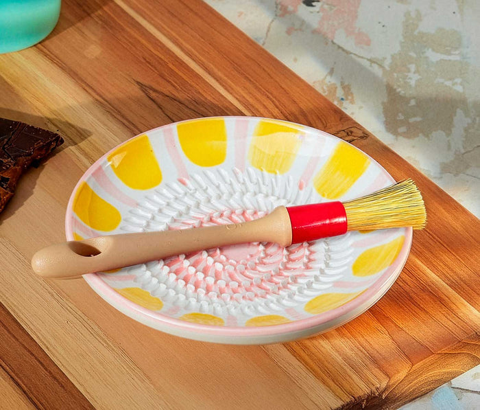 Pink Yellow Ceramic Food Grater and brush set on a wooden board- Lollygag