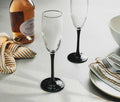 Vintage Cristal D'Arques black-stemmed fluted champagne glasses - Lollygag