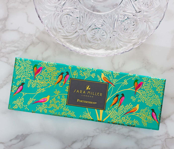 Sara Miller cake server box with colorful bird design on a marble surface