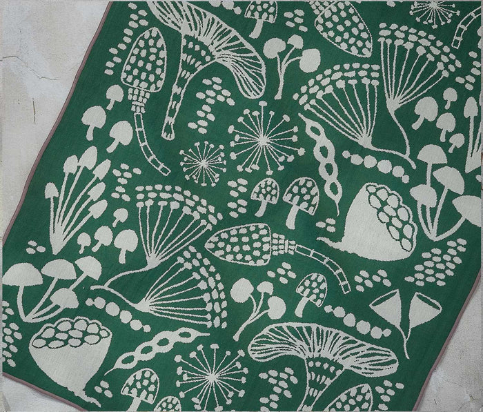 Reverse side of Wildgrove dishtowel showing mirrored ivory fungi and nature print